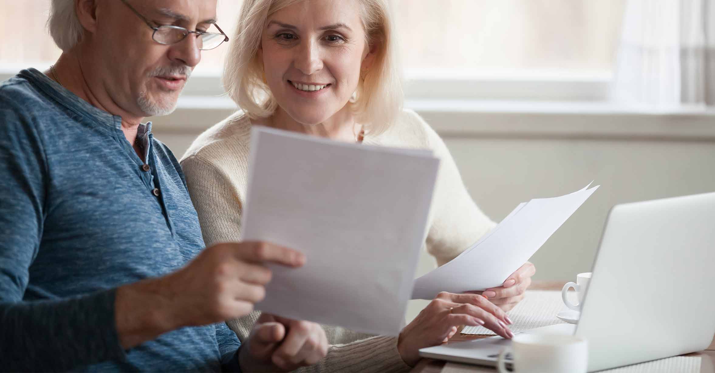 cold couple looking at papers
