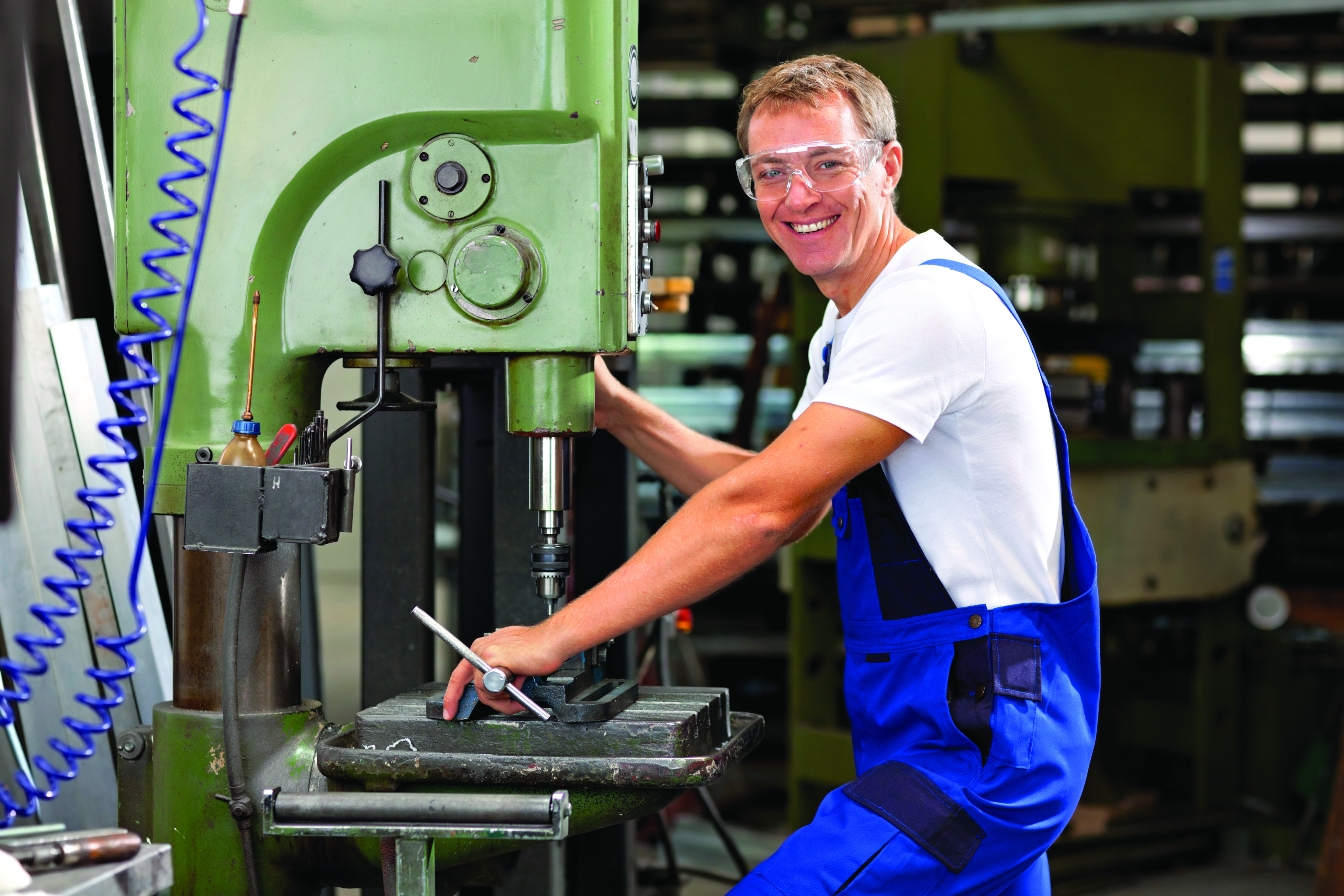 man working on cnc machine