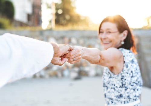 old couple holding hands
