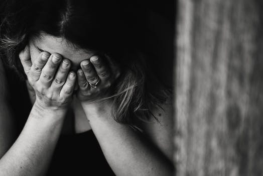 woman with hands on face