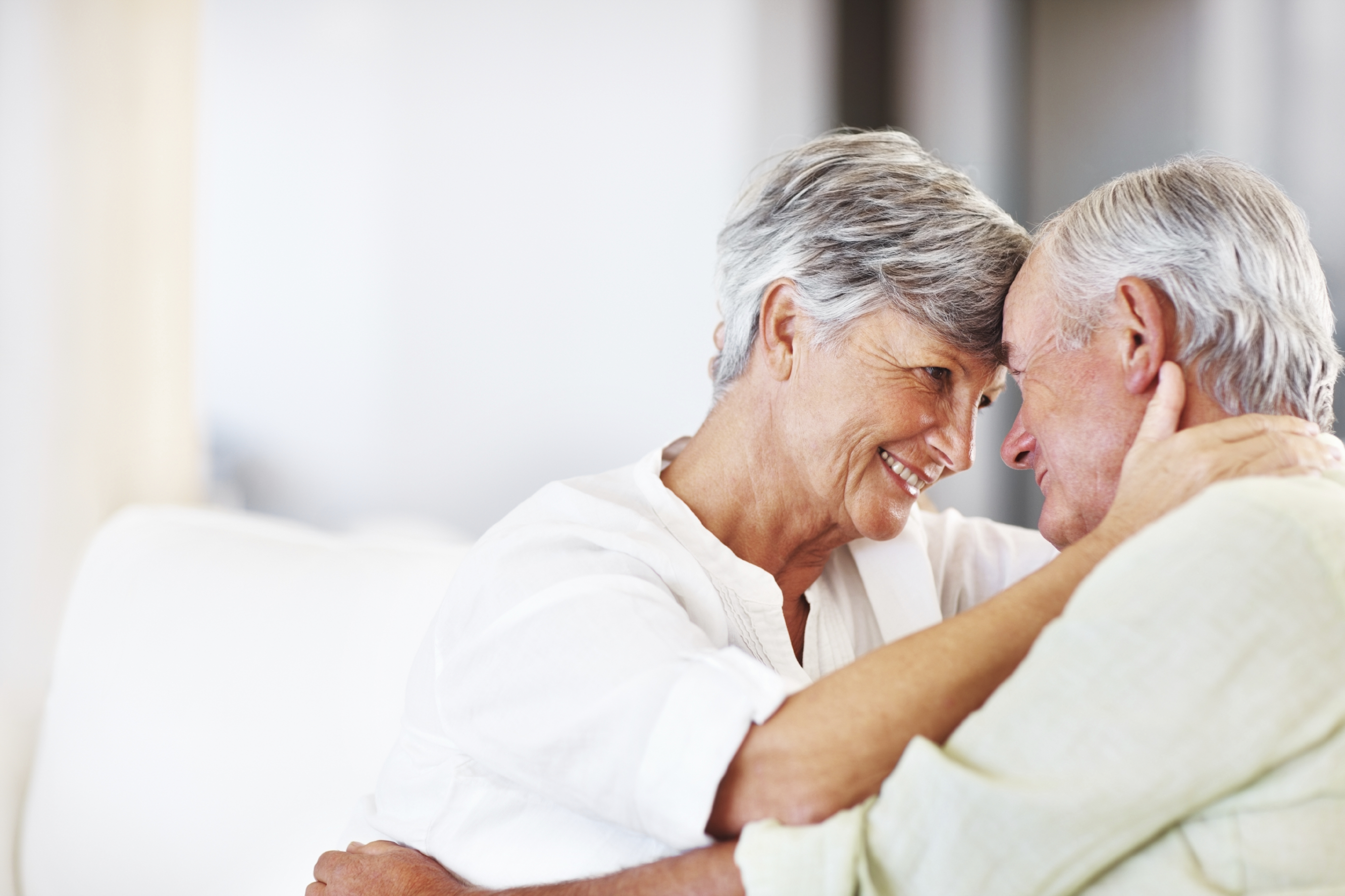 old couple hugging and smiling