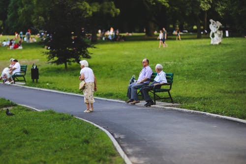 old woman walking in the park