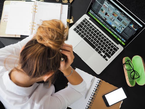 worried woman with computer