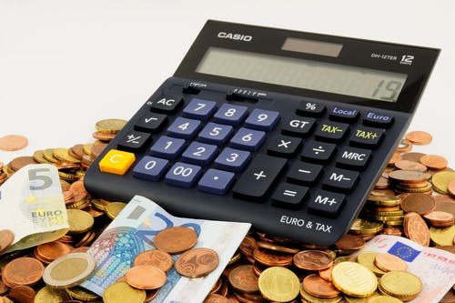 calculator on top of cash