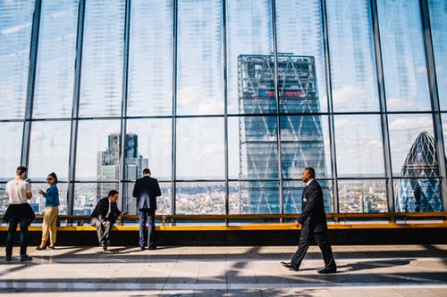 man walking with a background view of London
