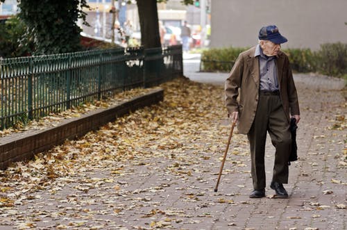 old person walking on the street