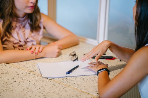 women discussing work
