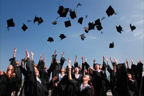 throwing graduation hats in the air