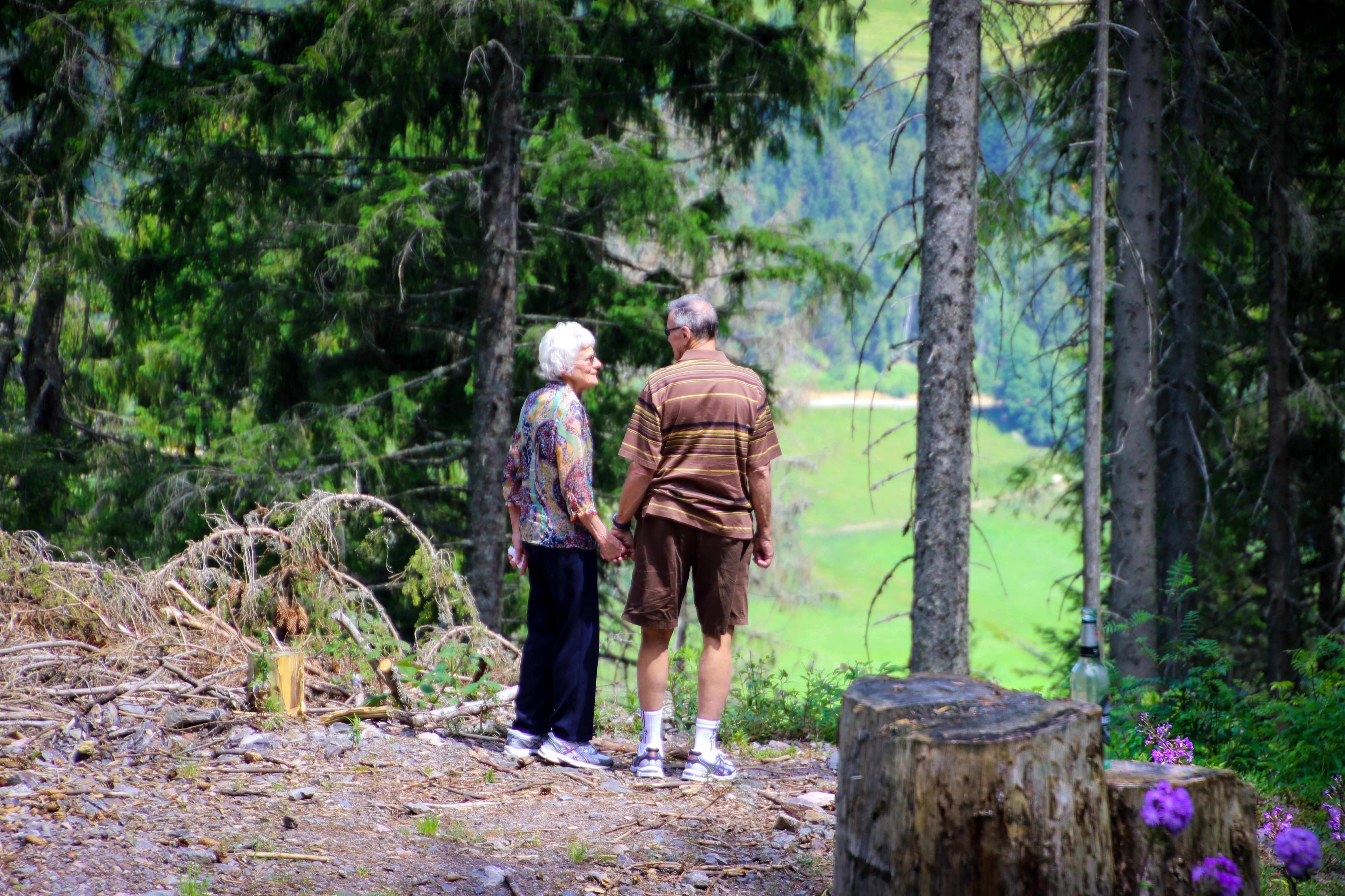 elderly couple in the woods