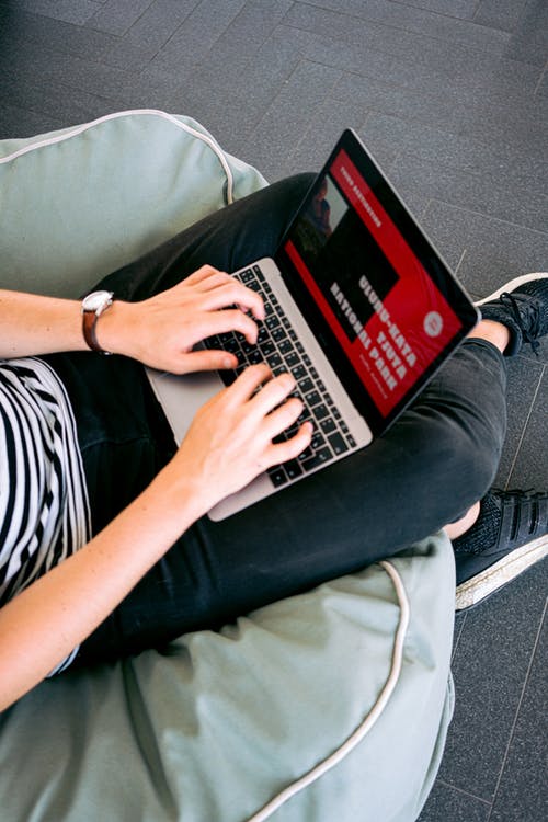 man working with a computer on the lap